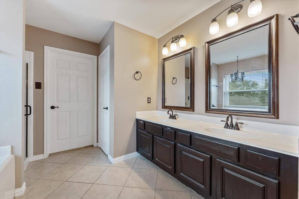 Primary bathroom with double sinks and lots of storage space.