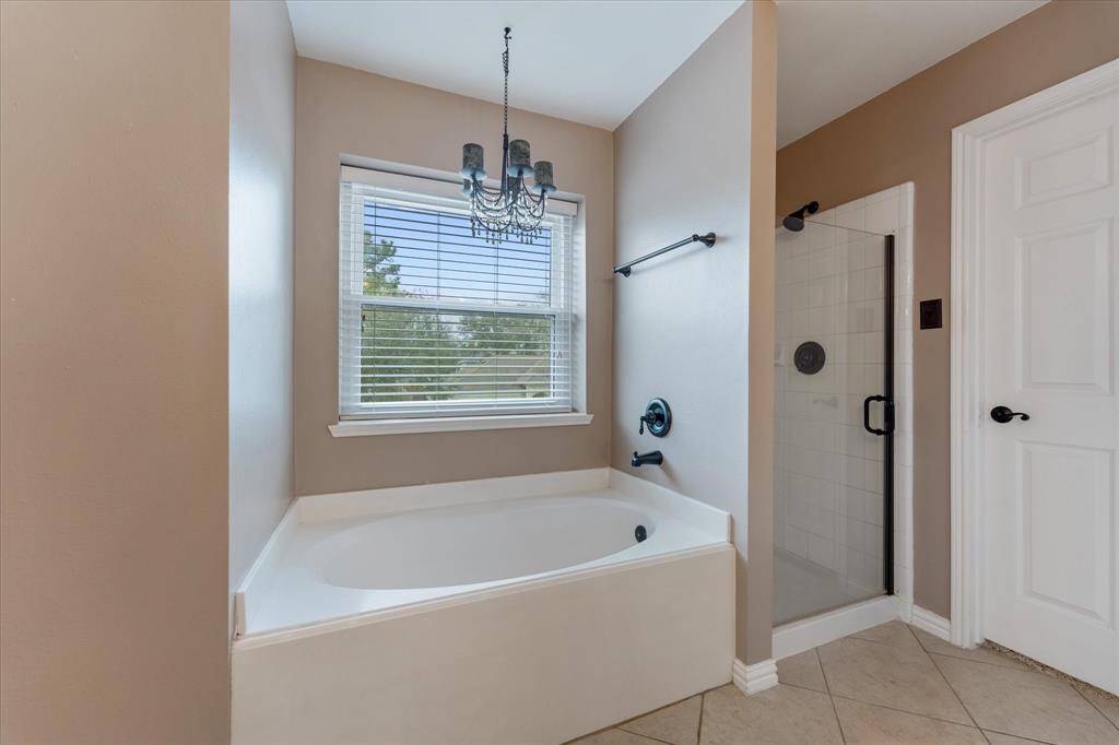 Separate tub and walk in shower, look at all that natural light!