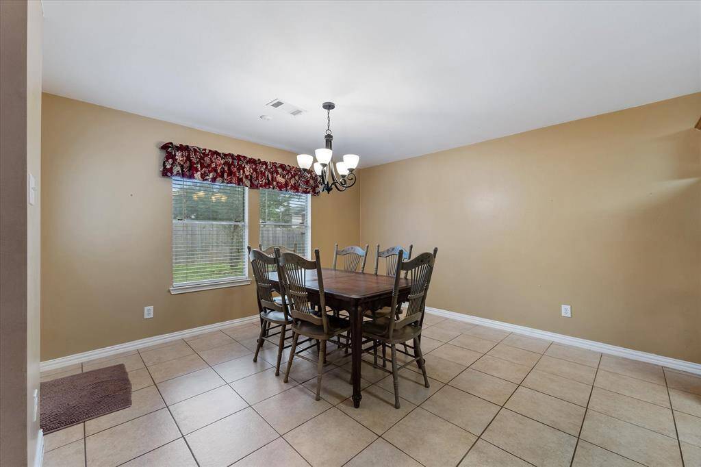 Breakfast area with backyard entry to the left.