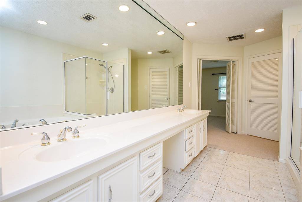 Primary en-suite bathroom.  Walk in shower.  Separate tub.  Two sinks.