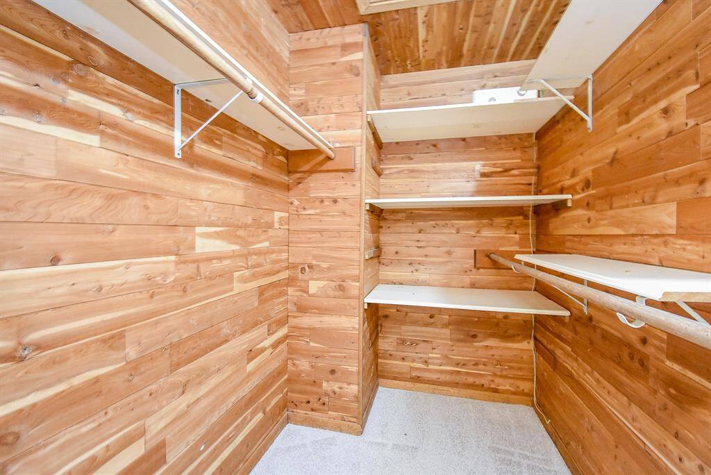 Secondary full bathroom with large vanity area, 2 sinks, storage, and a pocket door for the bath/tub and toilet area which makes sharing the bathroom a breeze.