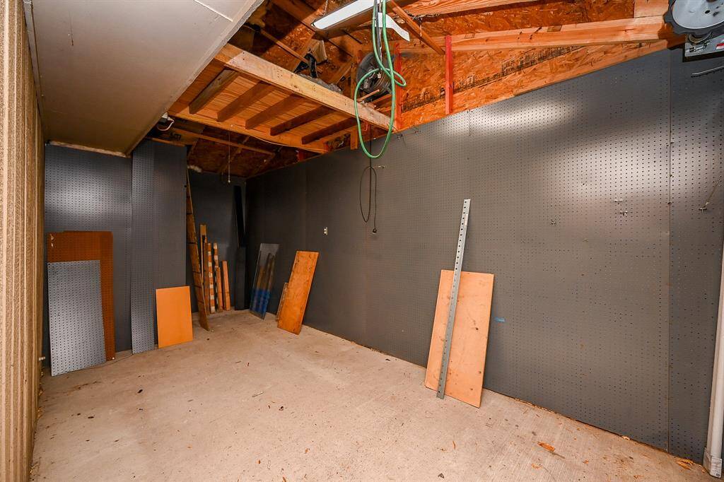 From the 3 car garage you can access the 4th storage bay with rollup door, attic fan and electricity. Perfect for any outdoor enthusiasts or hobbies.