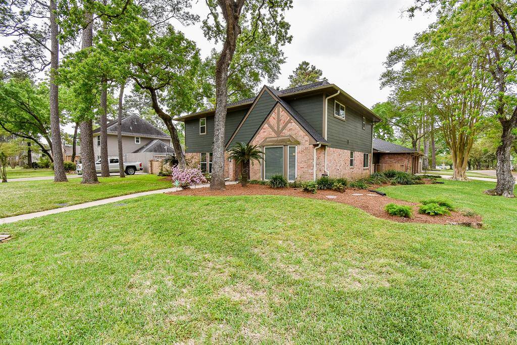 Count them 1,2,3 and a 4th roll up large bay seen here with the fence opened. Notice the extra wide driveway with plenty of room for family and friends to park.