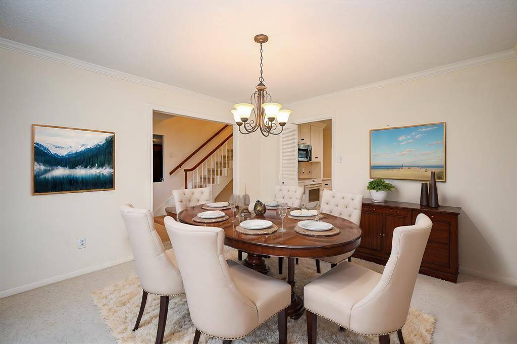 The large family room has a wood burning fireplace. (Virtually staged)