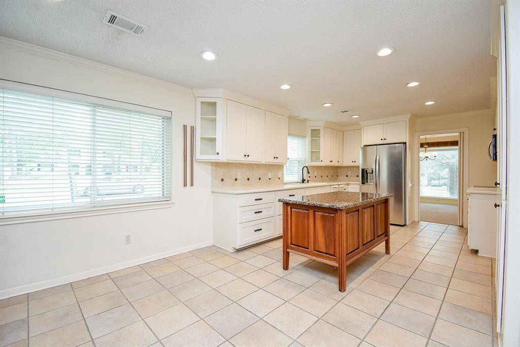 Check out the counter prep space and the work flow.  Take a look to the right.  That is a custom built pantry.