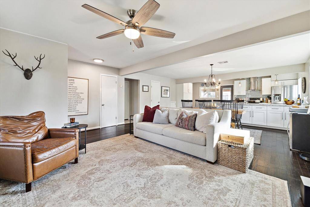 Another perspective of the living area showing the open concept to the dining and kitchen.