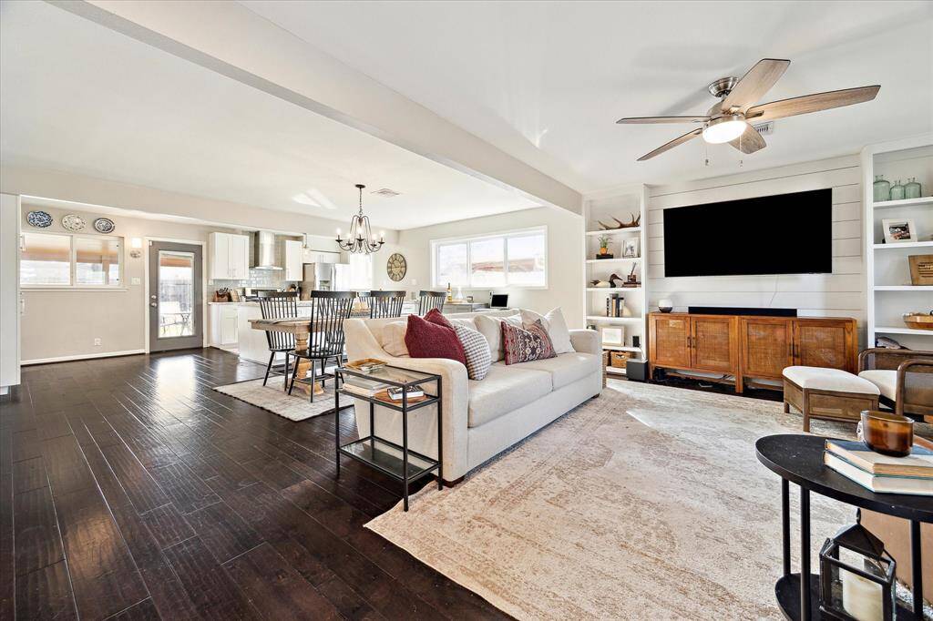 Appreciate the seamless flow of the living, dining, and kitchen space. Abundant light abounds through double pane windows (replaced in 2019).