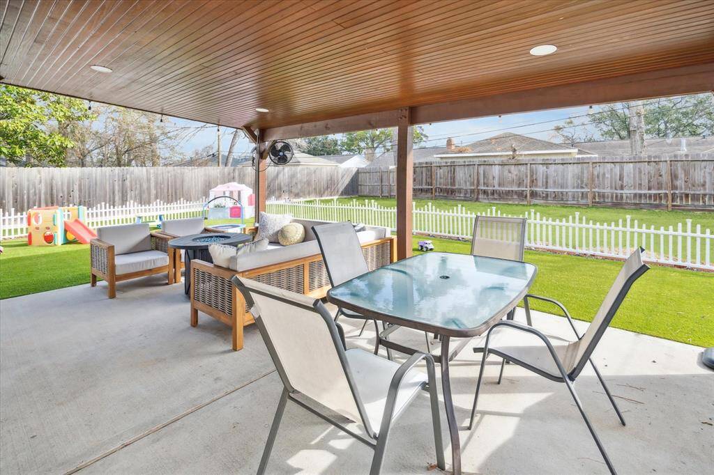 Completed in 2023 by the current owner, the outdoor living space is wired for electricity and features a beautiful wood paneled ceiling. The turfed yard is separate from the rest of the backyard and provides a low maintenance space for kids and pets to play.