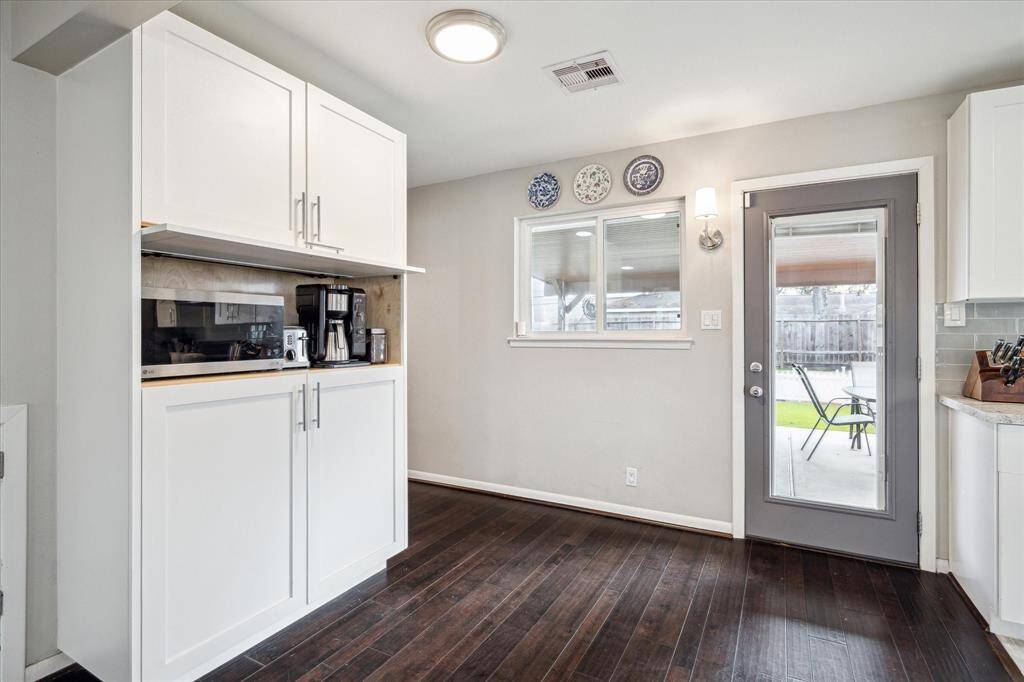 Convenient appliance garage with extra pantry storage.