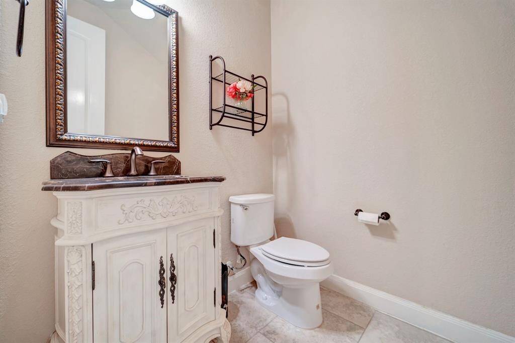 Convenient half bath located downstairs.