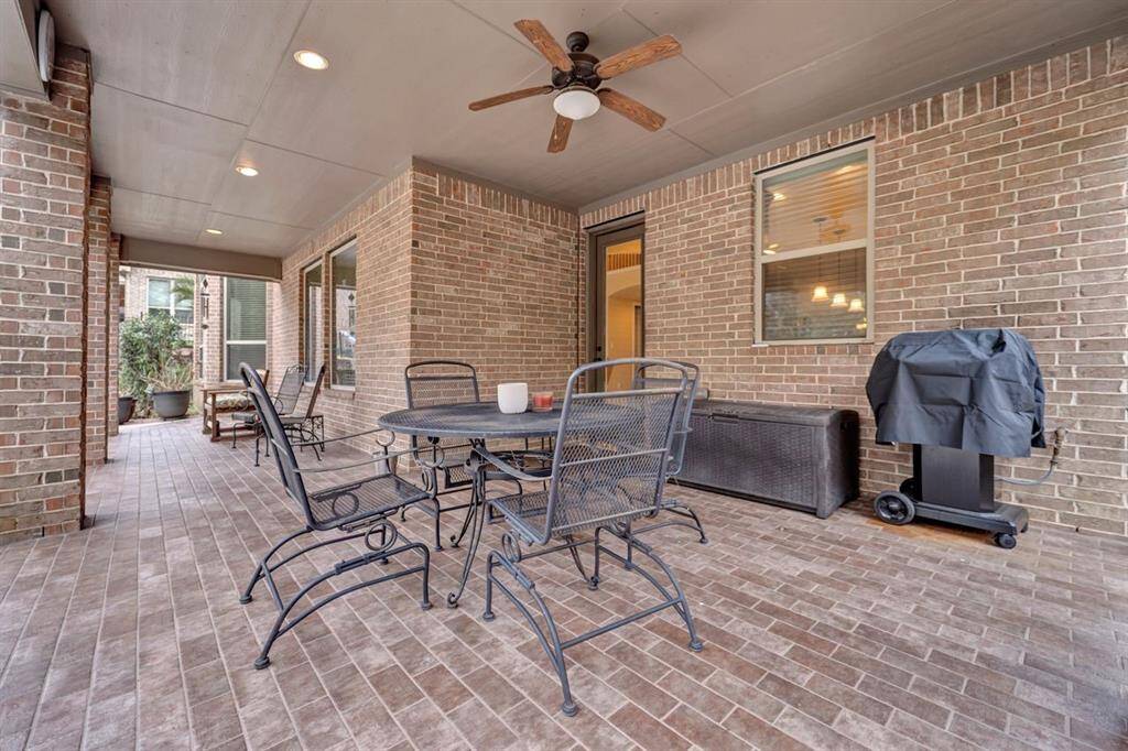 Oversized covered patio off the back of the home is a great place for evening dinners or a morning cup of coffee.