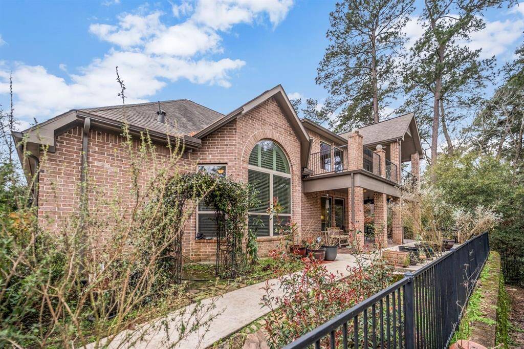 Brick exterior with arched windows and a covered porch.
