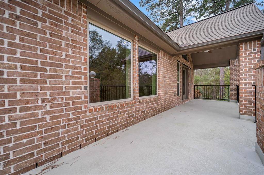 Large balcony on the second floor overlooking the peaceful reserve to the side and back of the property