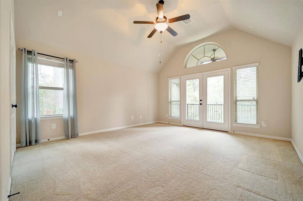 Large game room located upstairs with a balcony that is perfect for enjoying the wildlife in the natural reserve.