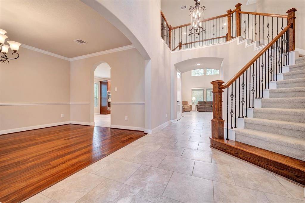 Walking in from the entry with a formal dining room to the left and an oversized office to the right.