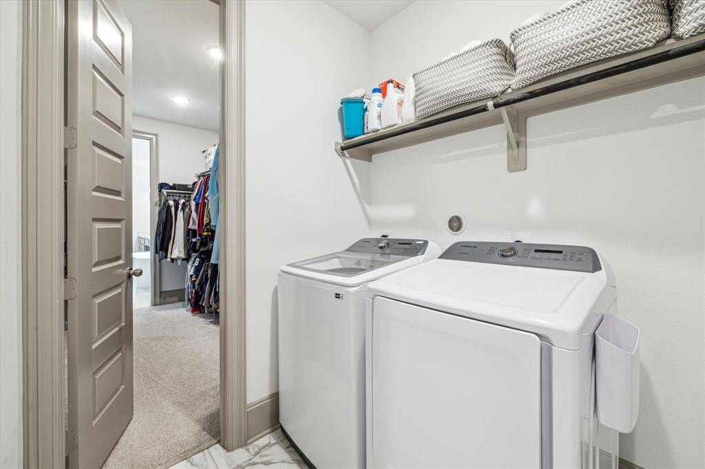 First floor utility room with access from primary closet