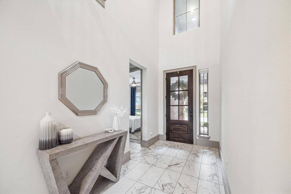 Formal entry with high ceilings and natural light