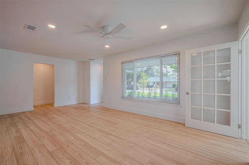Step into the inviting front entrance, highlighted by a large window that floods the space with natural light, creating a warm and welcoming atmosphere.