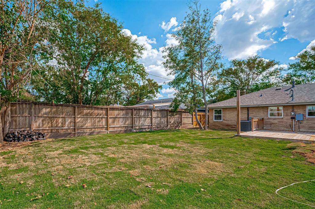Enjoy outdoor living in the expansive backyard, complete with a large deck for entertaining and a shed for extra storage.