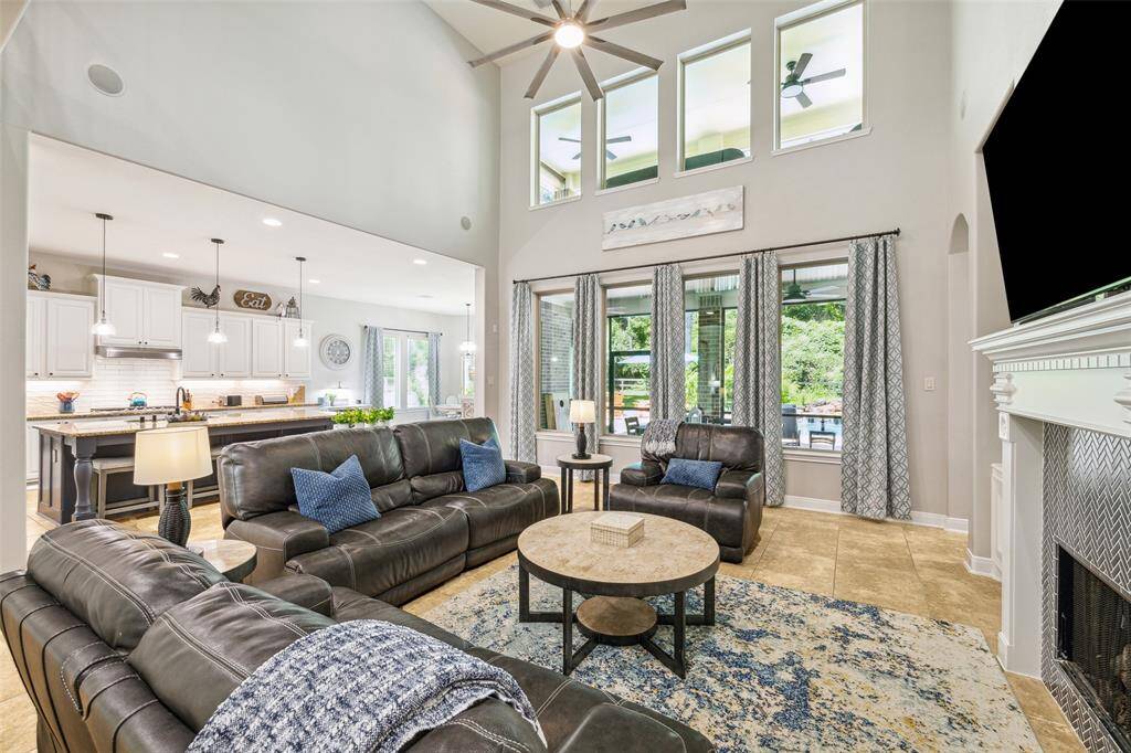 Large windows and open kitchen layout. Elegant, inviting, and well-lit space.