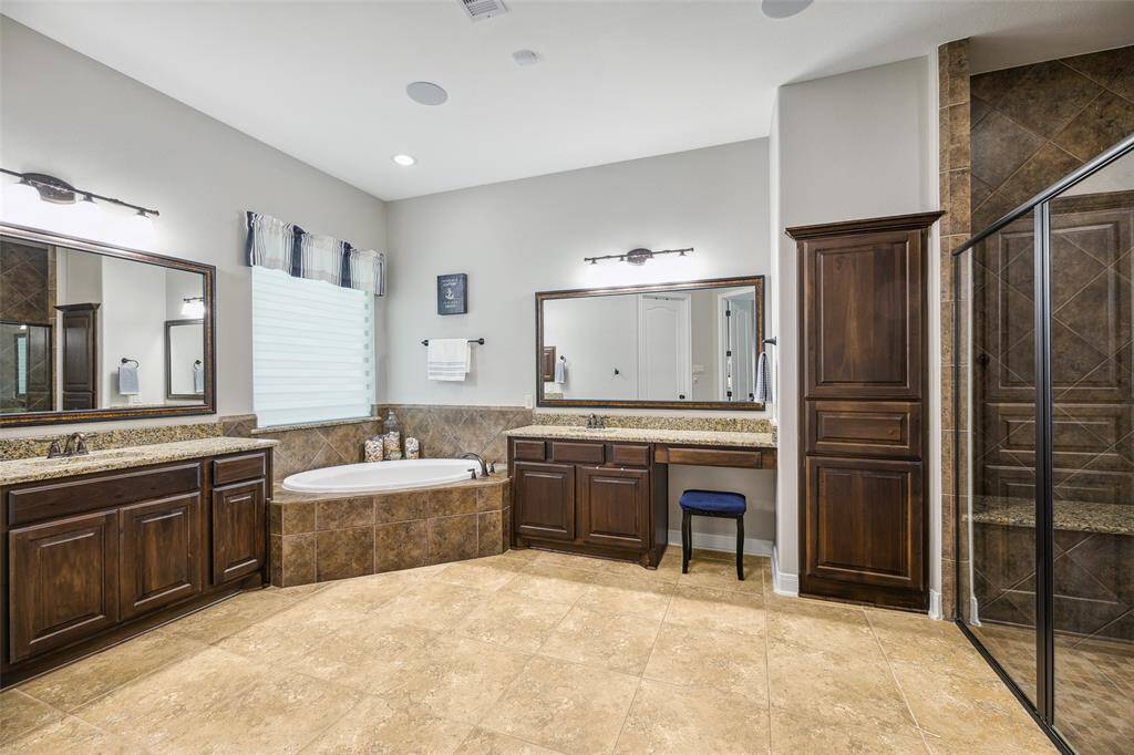 Priimary bath with garden tub and plenty of counter space.  Large walk in shower