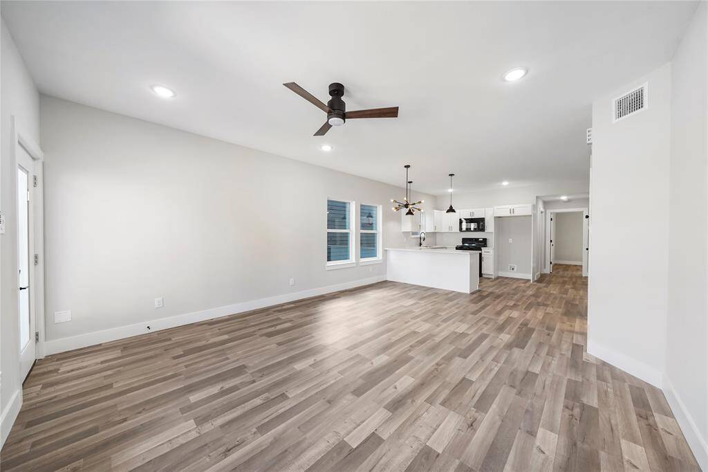 Photos of a different duplex with same layout and similar finishes.