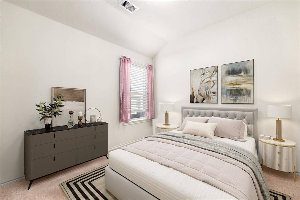 Secondary bedroom features plush carpet, neutral paint, and a large window with privacy blinds.