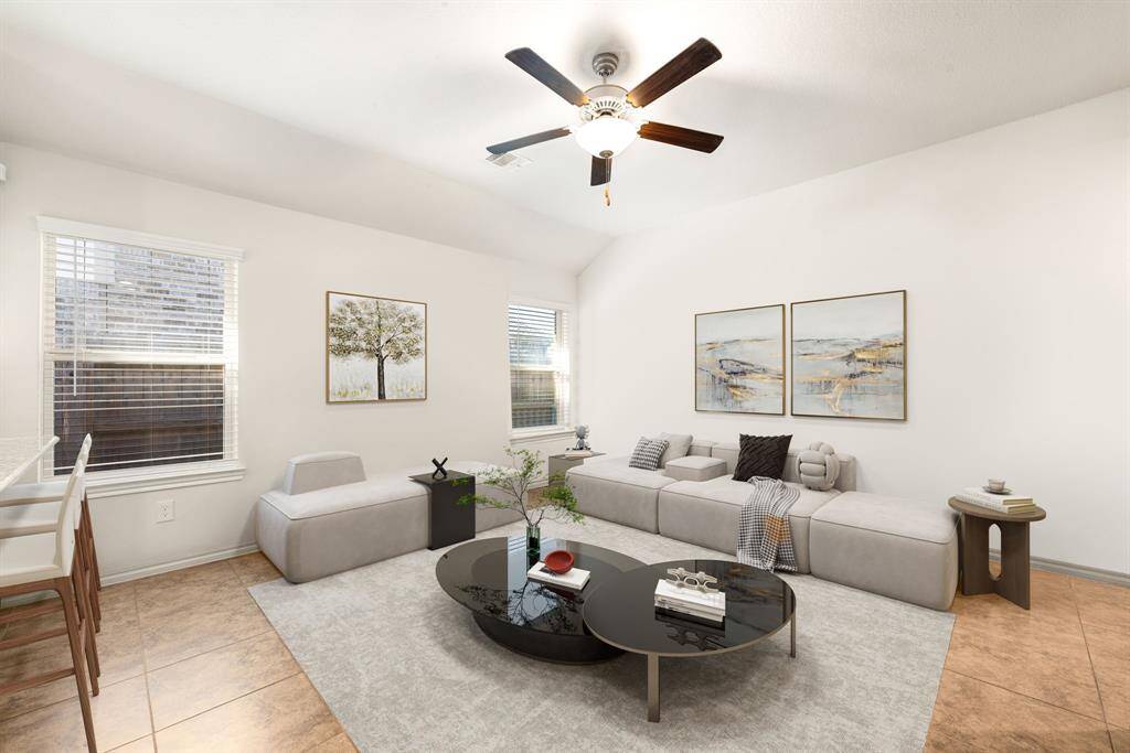 Gather the family and guests together in your lovely living room! Featuring high ceilings, dark stained ceiling fan, custom paint, gorgeous tile floors and large windows that provide plenty of natural lighting throughout the day.