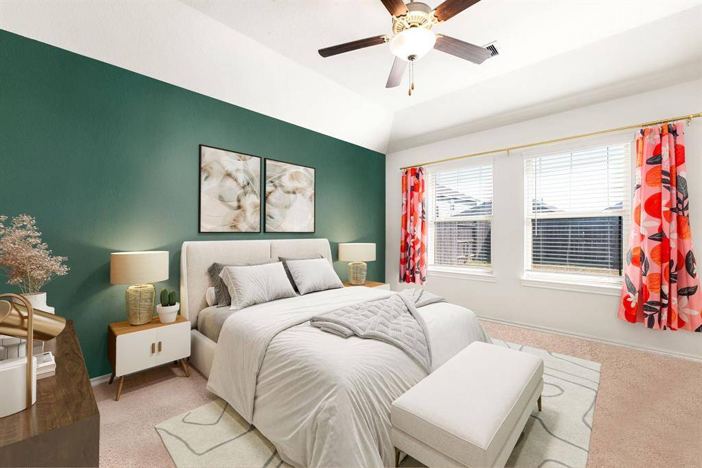 What a wonderful place to come home to, this stunning primary suite greets you with plush carpet floors, a custom feature wall, high ceiling, ceiling fan with lighting, lovely windows with blinds allowing in natural light brightening up this spacious primary bedroom, with extra space for a seating area.