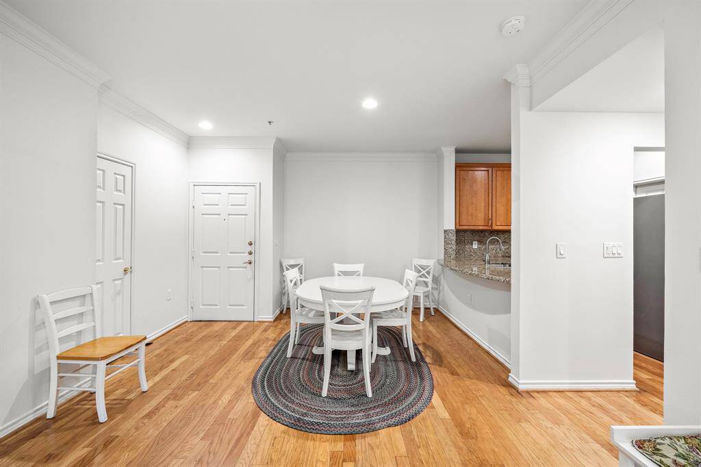 The dining area offers a chic setting for meals, with its proximity to the kitchen making serving and entertaining a breeze.