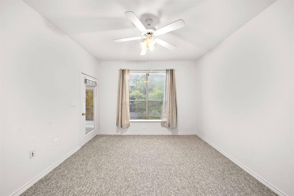 The spacious second bedroom is perfect for guests or as a home office, offering its own private bath.