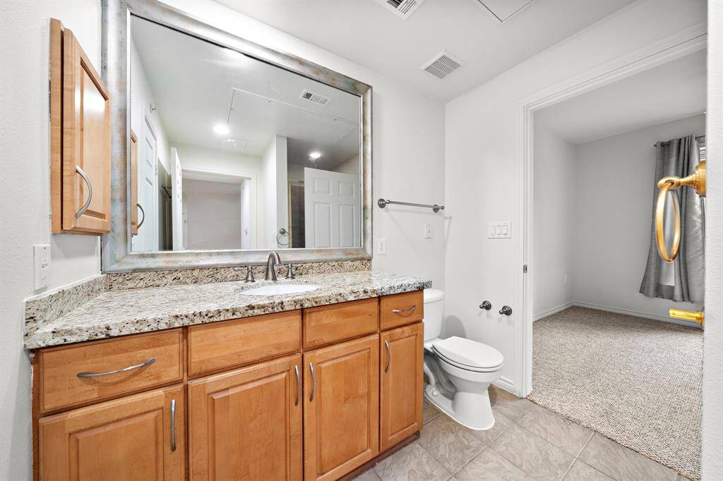 The second bathroom features a sleek tub/shower combo with modern finishes, ensuring your guests feel pampered.