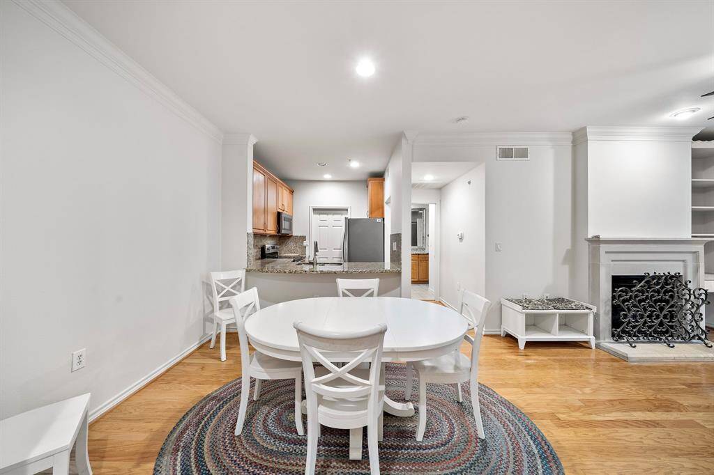Adjacent to the living room, the dining area provides an open yet intimate space, ideal for hosting dinner parties or casual family meals.