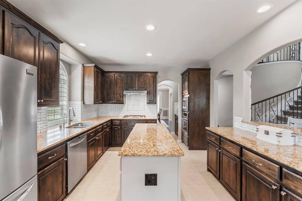 The family chef will enjoy all this space, the wall mounted microwave, oven, and countertop gas range. Look at all that storage!