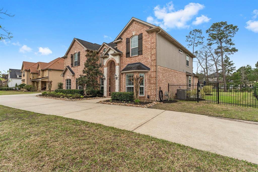 A corner lot and circle driveway offer many options for parking.