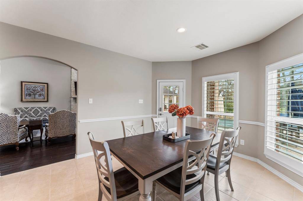 The large breakfast area is just off the kitchen and leads to the backyard.