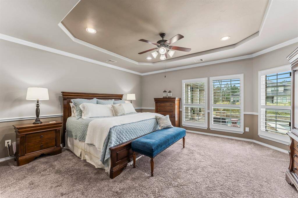 Ah! The Primary suite! It is located privately at the back corner of the home and has a great view of the backyard!
