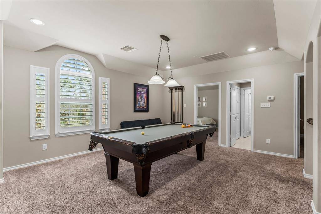 The gameroom is located centrally upstairs to the secondary bedrooms and huge media room!