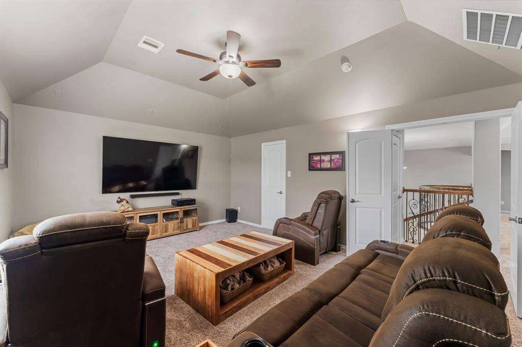 For a theatre experience, close the double doors. The media room also has a large storage closet.