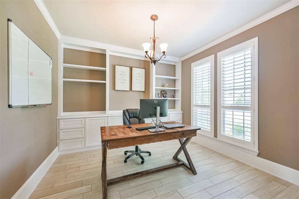Study Features a French Door Entry and Custom Built-Ins