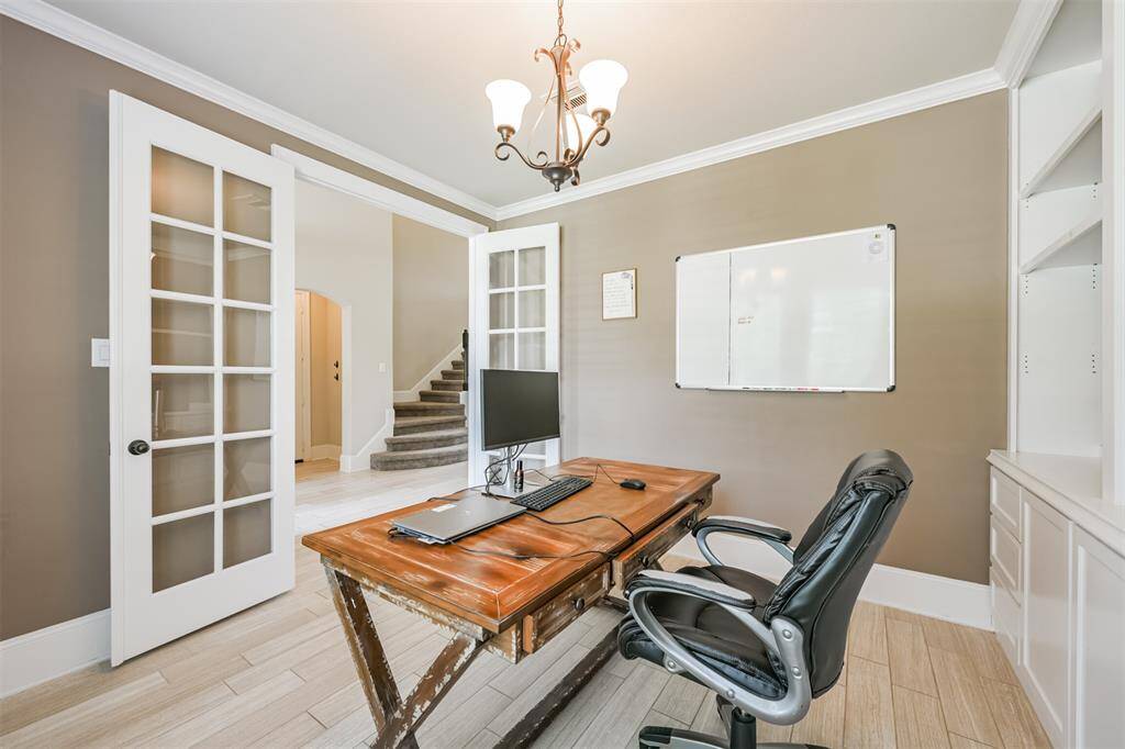 Study Features a French Door Entry and Custom Built-Ins