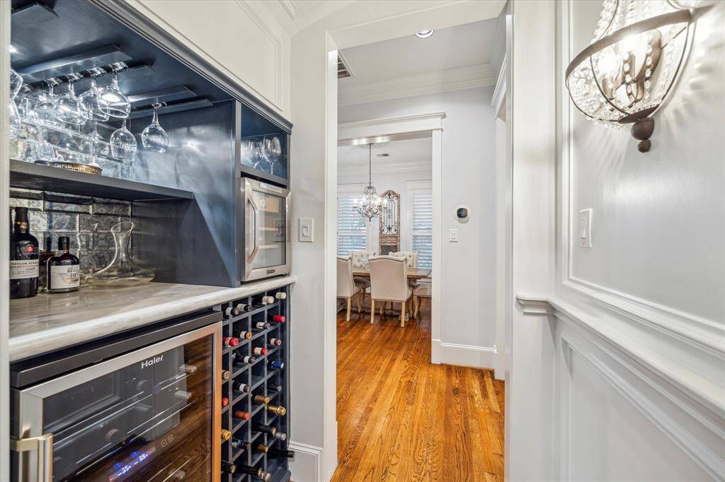 Stylish dry bar featuring a wine refrigerator, dedicated wine storage, and a humidor—perfect for entertaining and storing your finest collections.