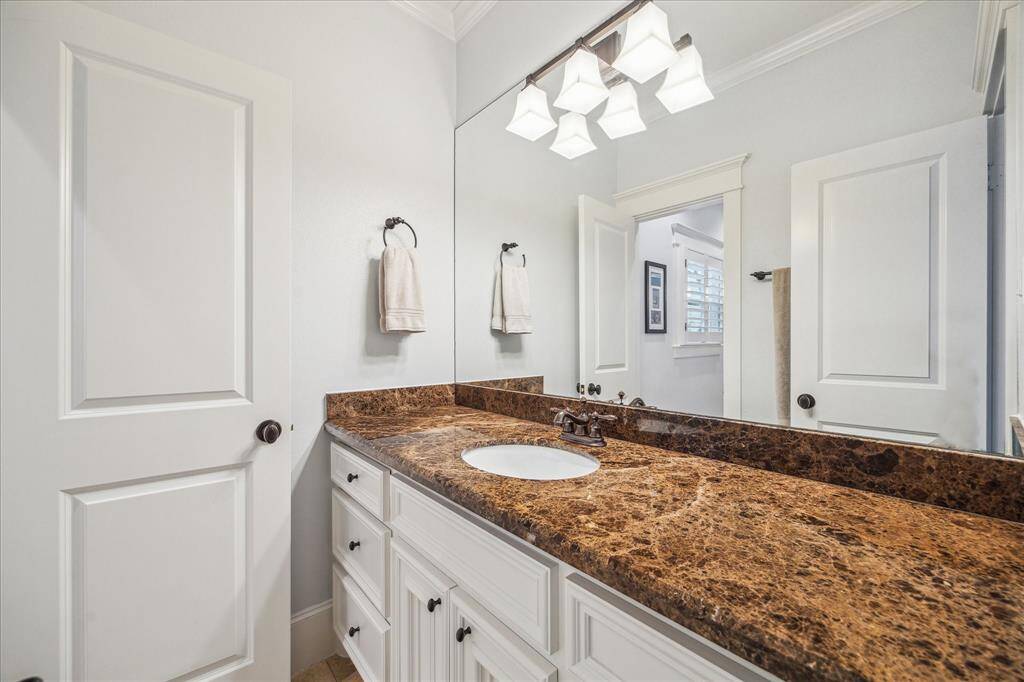 View of the vanity space in the shared bath that connects to the third bedroom.
