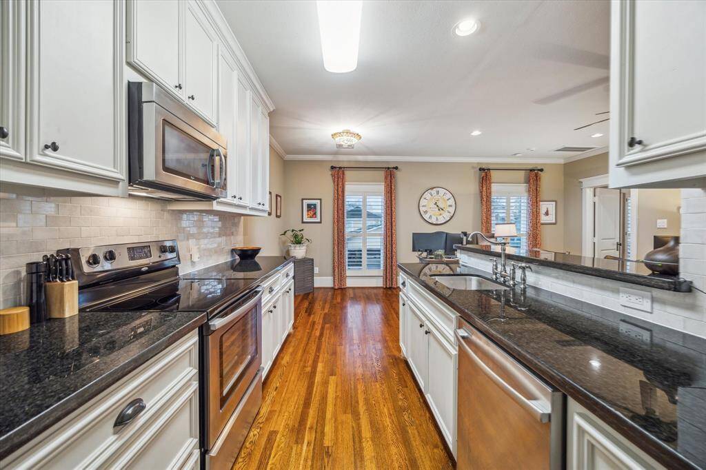 Kitchen in the garage apartment featuring stainless steel appliances, ample counter space, plenty of storage and a pantry.