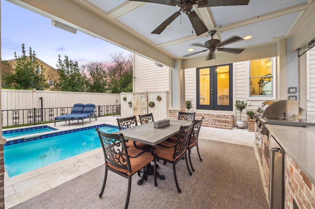 The covered stone paver patio with outdoor kitchen was added in 2019 and boasts a 42” 5 burner Blaze grill, side burner, Blaze refrigerator, sink, two fans and 2 built-in storage cabinets.