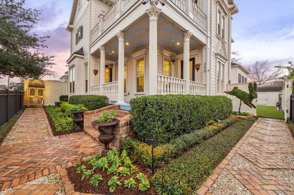 Fully fenced yard with paver steps surround the beautiful landscaping. A smart home irrigation system with drip lines help keep the plants and flowers thriving year-round.