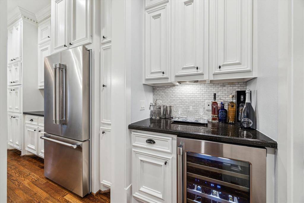 Functional butler’s pantry with a built-in wine fridge and plenty of storage—perfect for entertaining and effortless organization.
