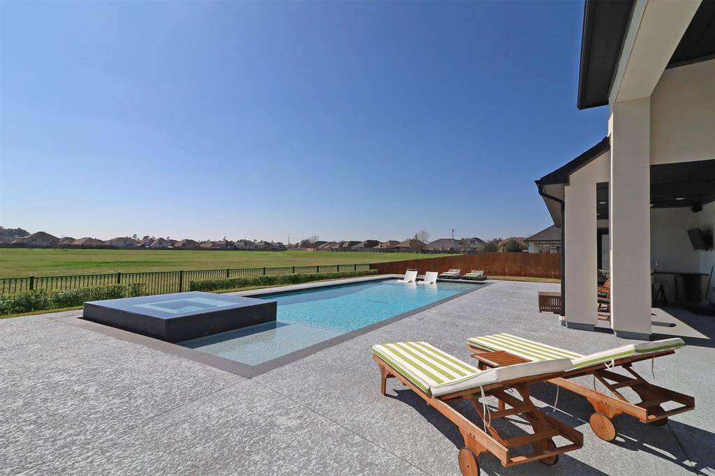 Heated pool & spa over looking greenspace.