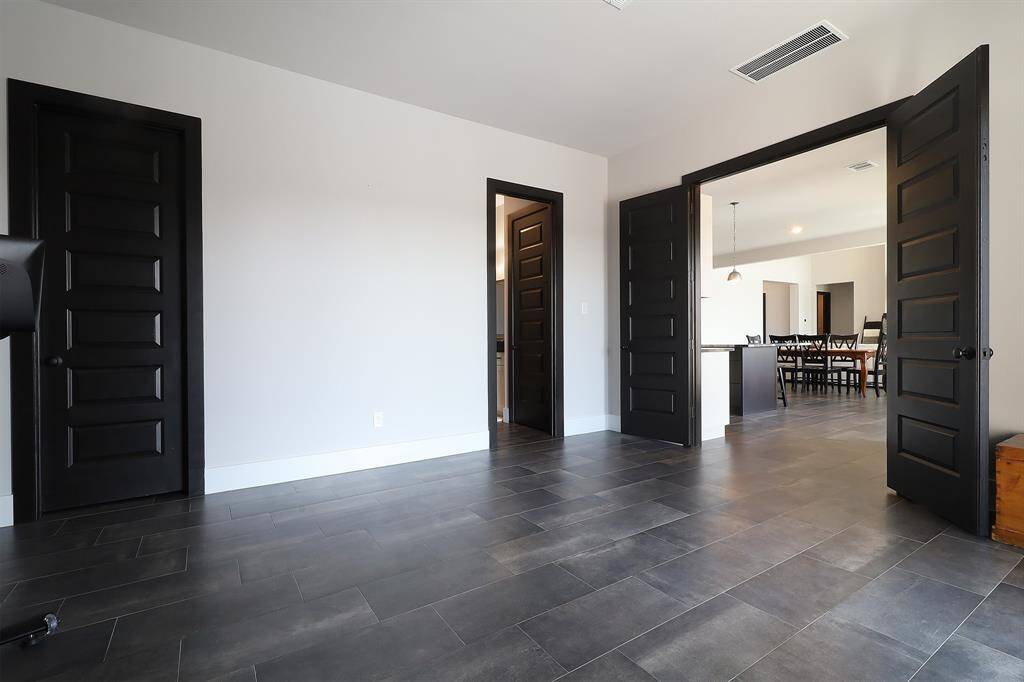 Media room has access to the kitchen area and the patio/pool.