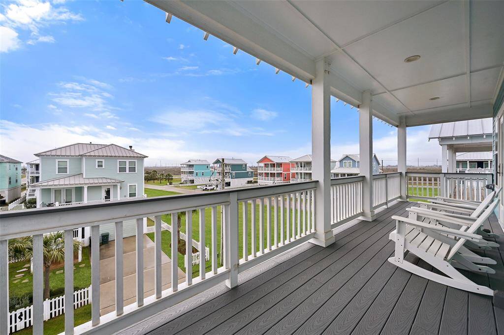 Spacious upper-deck with beauty-boarded patio brings leisure and luxury.  This beautiful balcony is accessed by the primary bedroom.  Relax in style!
